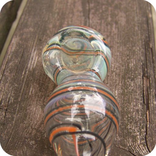 Hand blown, silver fumed, color changing glass pipe with colored stripes spiraled around its puffed out body and tapered mouthpiece